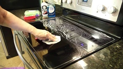 Use A Damp Rag To Scrub Off The Grease